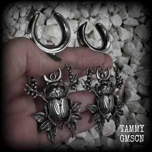 These gorgeous earrings feature large antique silver scarab beetles surrounded by berries and leaves with a crescent moon, measuring just on 9cms from tip to tip, and weighing 20 grams a piece.  This pair has been made on 1” gauge (25mm) gauge surgical steel cradles, to be worn in stretched lobes.