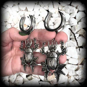 These gorgeous earrings feature large antique silver scarab beetles surrounded by berries and leaves with a crescent moon, measuring just on 9cms from tip to tip, and weighing 20 grams a piece.  This pair has been made on 1” gauge (25mm) gauge surgical steel cradles, to be worn in stretched lobes.