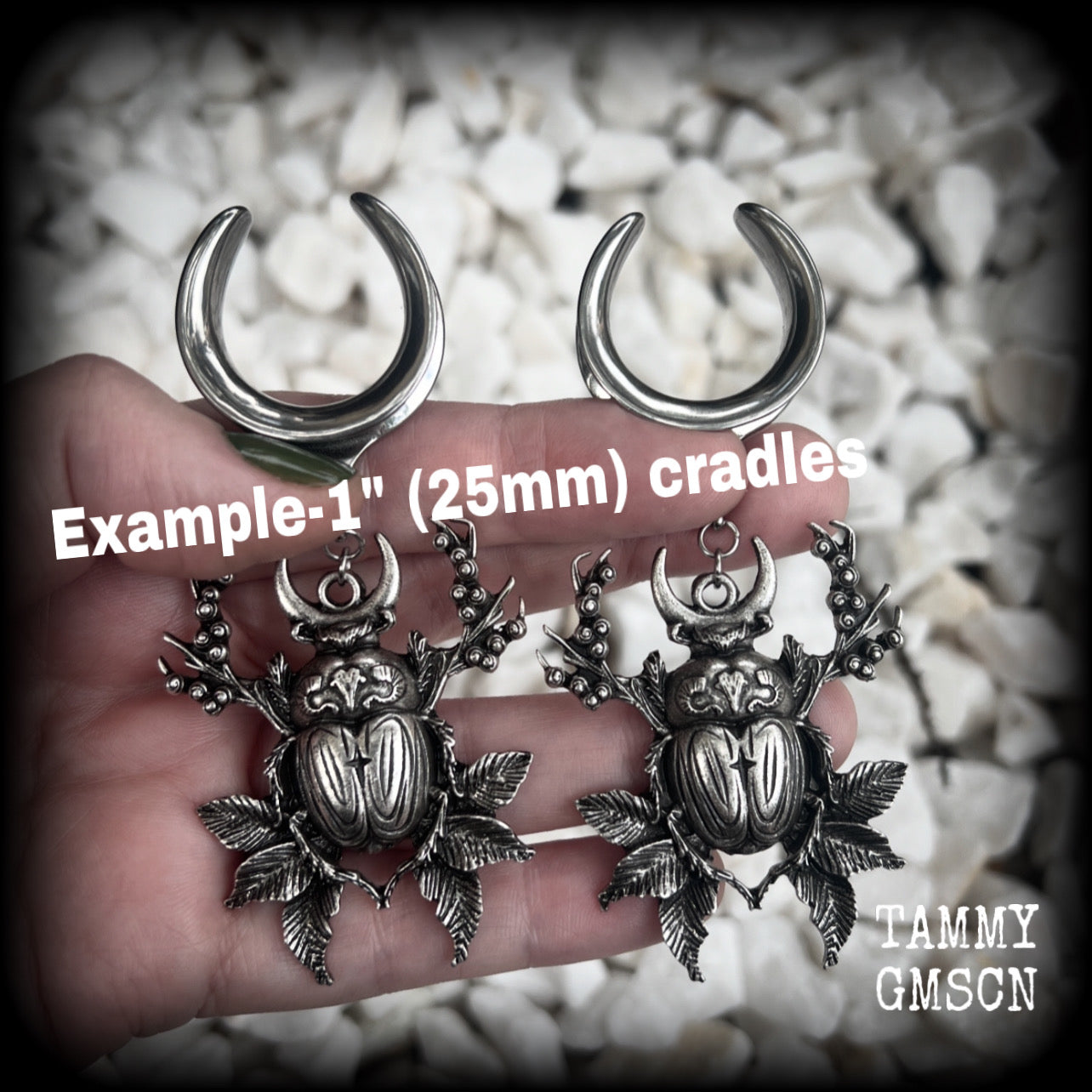These gorgeous earrings feature large antique silver scarab beetles surrounded by berries and leaves with a crescent moon, measuring just on 9cms from tip to tip, and weighing 20 grams a piece.  This pair has been made on 1” gauge (25mm) gauge surgical steel cradles, to be worn in stretched lobes.