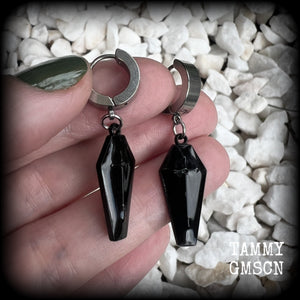 These awesome earrings feature gorgeous black enamel coffins, are nice and lightweight at 3 grams each, and measure in at just over 4cms from tip to tip.

This pair have been made on stainless steel huggie ear cuffs, suitable for pierced ears.