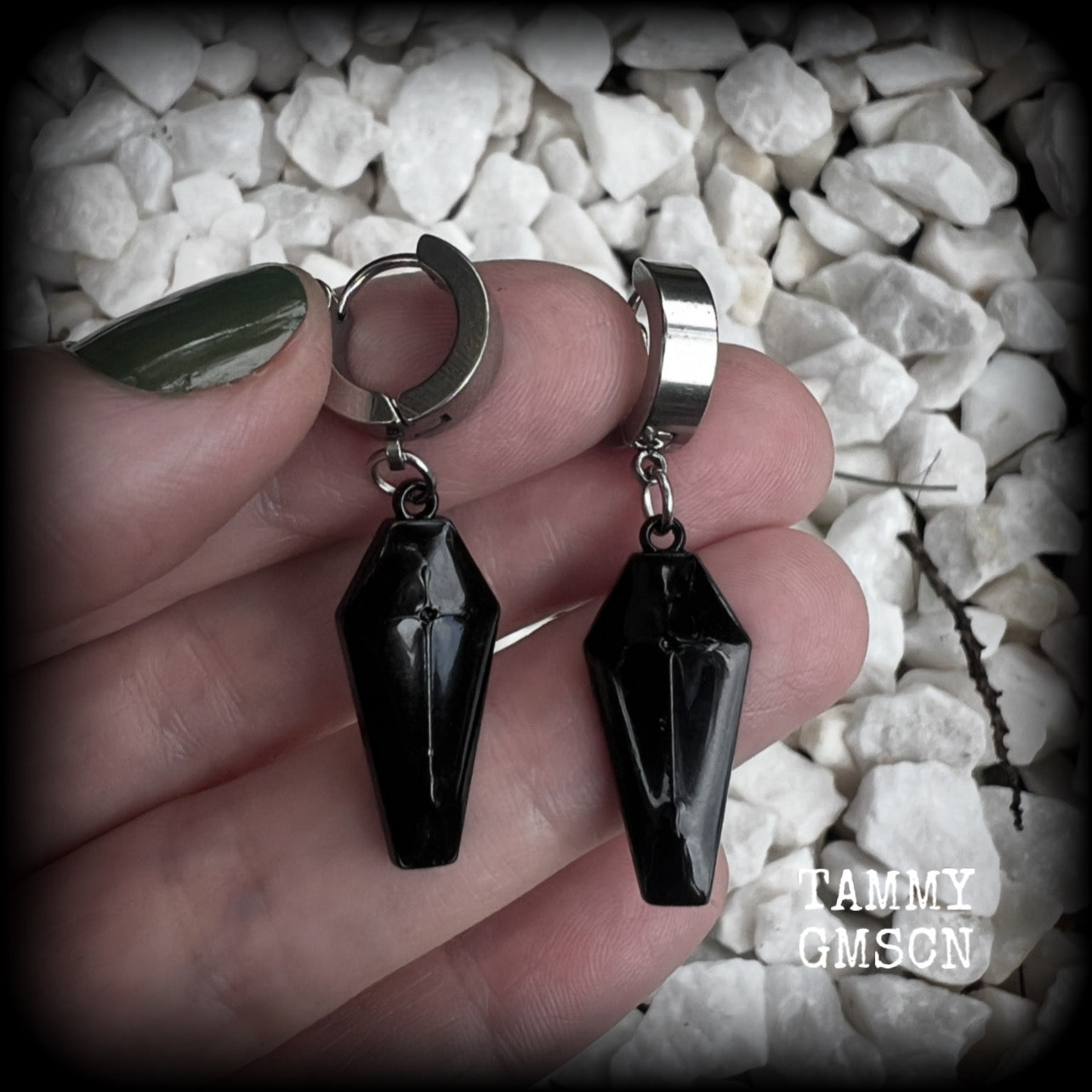 These awesome earrings feature gorgeous black enamel coffins, are nice and lightweight at 3 grams each, and measure in at just over 4cms from tip to tip.

This pair have been made on stainless steel huggie ear cuffs, suitable for pierced ears.