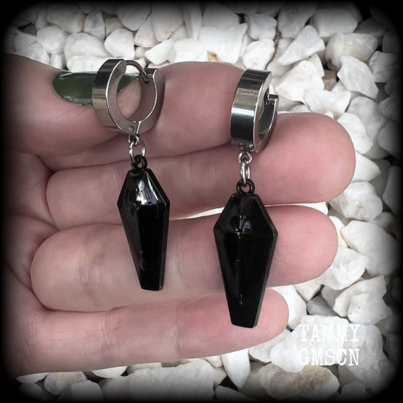 These awesome earrings feature gorgeous black enamel coffins, are nice and lightweight at 3 grams each, and measure in at just over 4cms from tip to tip.

This pair have been made on stainless steel huggie ear cuffs, suitable for pierced ears.