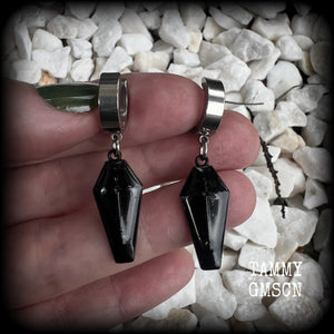 These awesome earrings feature gorgeous black enamel coffins, are nice and lightweight at 3 grams each, and measure in at just over 4cms from tip to tip.

This pair have been made on stainless steel huggie ear cuffs, suitable for pierced ears.