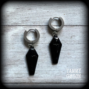 These awesome earrings feature gorgeous black enamel coffins, are nice and lightweight at 3 grams each, and measure in at just over 4cms from tip to tip.

This pair have been made on stainless steel huggie ear cuffs, suitable for pierced ears.