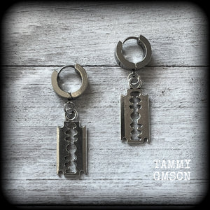 These awesome earrings feature antique silver razor blades, are nice and lightweight at approx 3 grams each, and measure in at just over 4cms from tip to tip.

This pair have been made on stainless steel huggie ear cuffs, suitable for pierced ears.