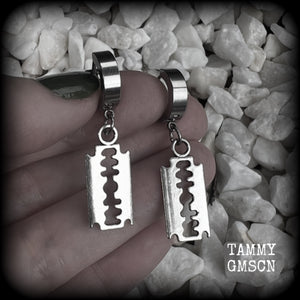 These awesome earrings feature antique silver razor blades, are nice and lightweight at approx 3 grams each, and measure in at just over 4cms from tip to tip.

This pair have been made on stainless steel huggie ear cuffs, suitable for pierced ears.
