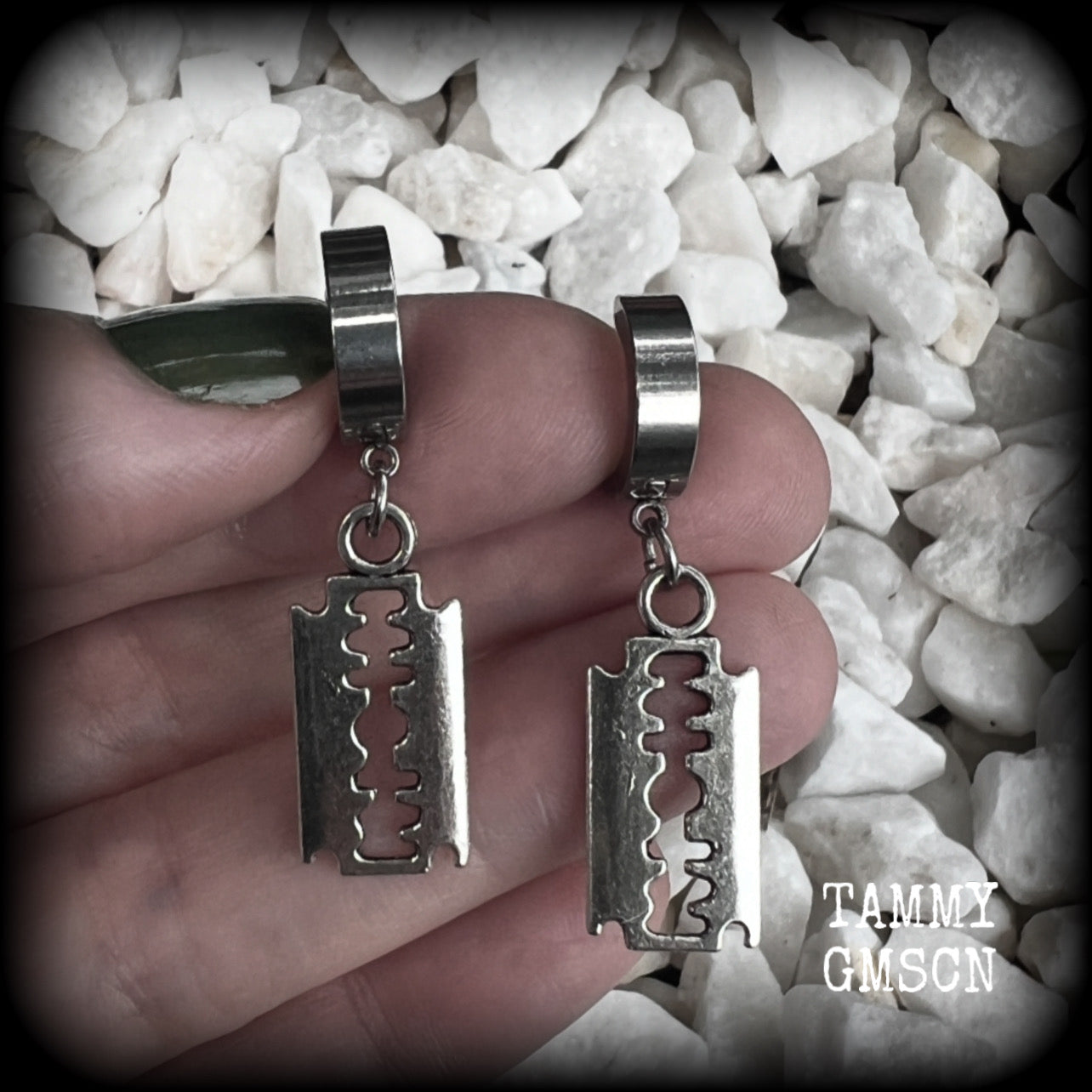These awesome earrings feature antique silver razor blades, are nice and lightweight at approx 3 grams each, and measure in at just over 4cms from tip to tip.

This pair have been made on stainless steel huggie ear cuffs, suitable for pierced ears.