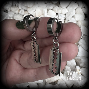 These awesome earrings feature antique silver razor blades, are nice and lightweight at approx 3 grams each, and measure in at just over 4cms from tip to tip.

This pair have been made on stainless steel huggie ear cuffs, suitable for pierced ears.