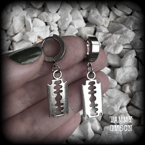 These awesome earrings feature antique silver razor blades, are nice and lightweight at approx 3 grams each, and measure in at just over 4cms from tip to tip.

This pair have been made on stainless steel huggie ear cuffs, suitable for pierced ears.
