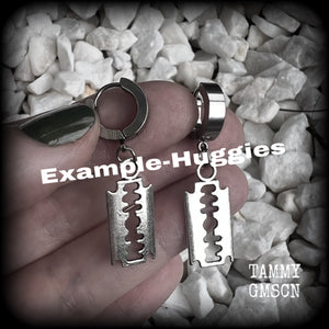 These awesome earrings feature antique silver razor blades, are nice and lightweight at approx 3 grams each, and measure in at just over 4cms from tip to tip.

This pair have been made on stainless steel huggie ear cuffs, suitable for pierced ears.