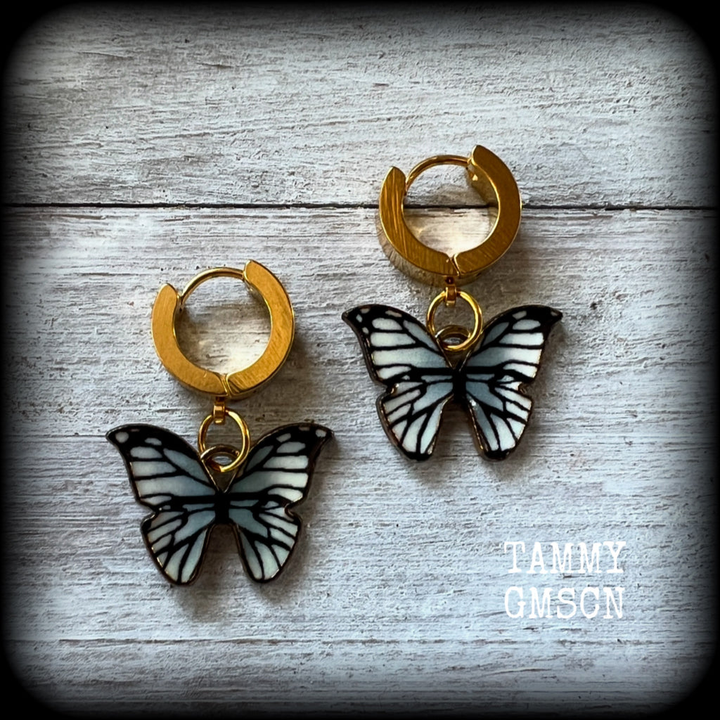 These awesome earrings feature antique gold and enamel blue butterflies, are nice and lightweight at only a few grams each, and measure in at approx 3cms from tip to tip.

This pair have been made on stainless steel huggie ear cuffs, suitable for pierced ears.
