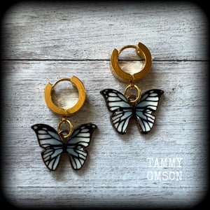 These awesome earrings feature antique gold and enamel blue butterflies, are nice and lightweight at only a few grams each, and measure in at approx 3cms from tip to tip.

This pair have been made on stainless steel huggie ear cuffs, suitable for pierced ears.