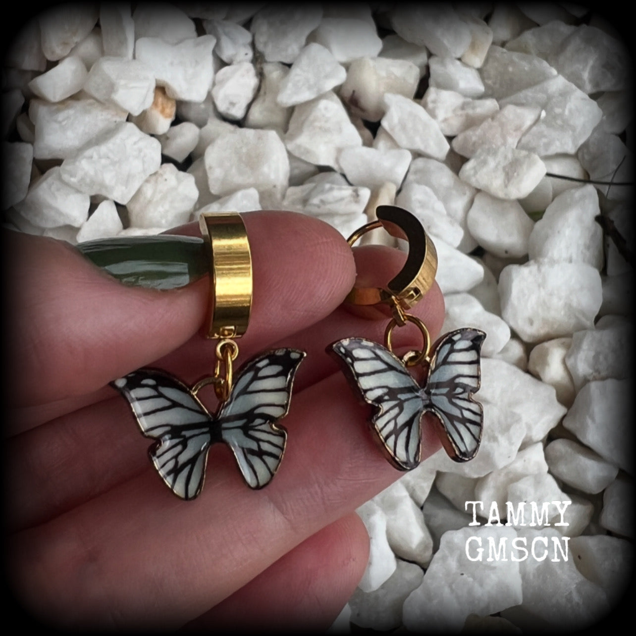 These awesome earrings feature antique gold and enamel blue butterflies, are nice and lightweight at only a few grams each, and measure in at approx 3cms from tip to tip.

This pair have been made on stainless steel huggie ear cuffs, suitable for pierced ears.