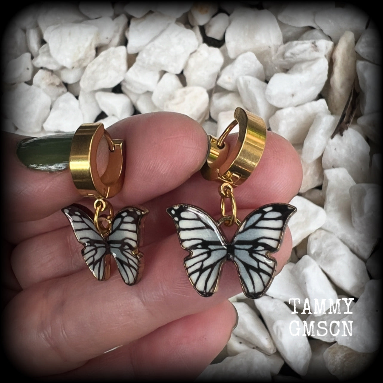 These awesome earrings feature antique gold and enamel blue butterflies, are nice and lightweight at only a few grams each, and measure in at approx 3cms from tip to tip.

This pair have been made on stainless steel huggie ear cuffs, suitable for pierced ears.