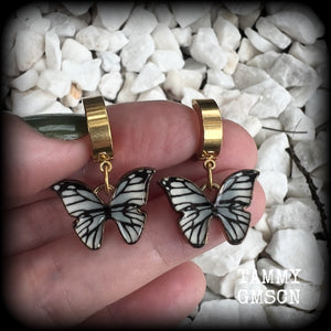 These awesome earrings feature antique gold and enamel blue butterflies, are nice and lightweight at only a few grams each, and measure in at approx 3cms from tip to tip.

This pair have been made on stainless steel huggie ear cuffs, suitable for pierced ears.
