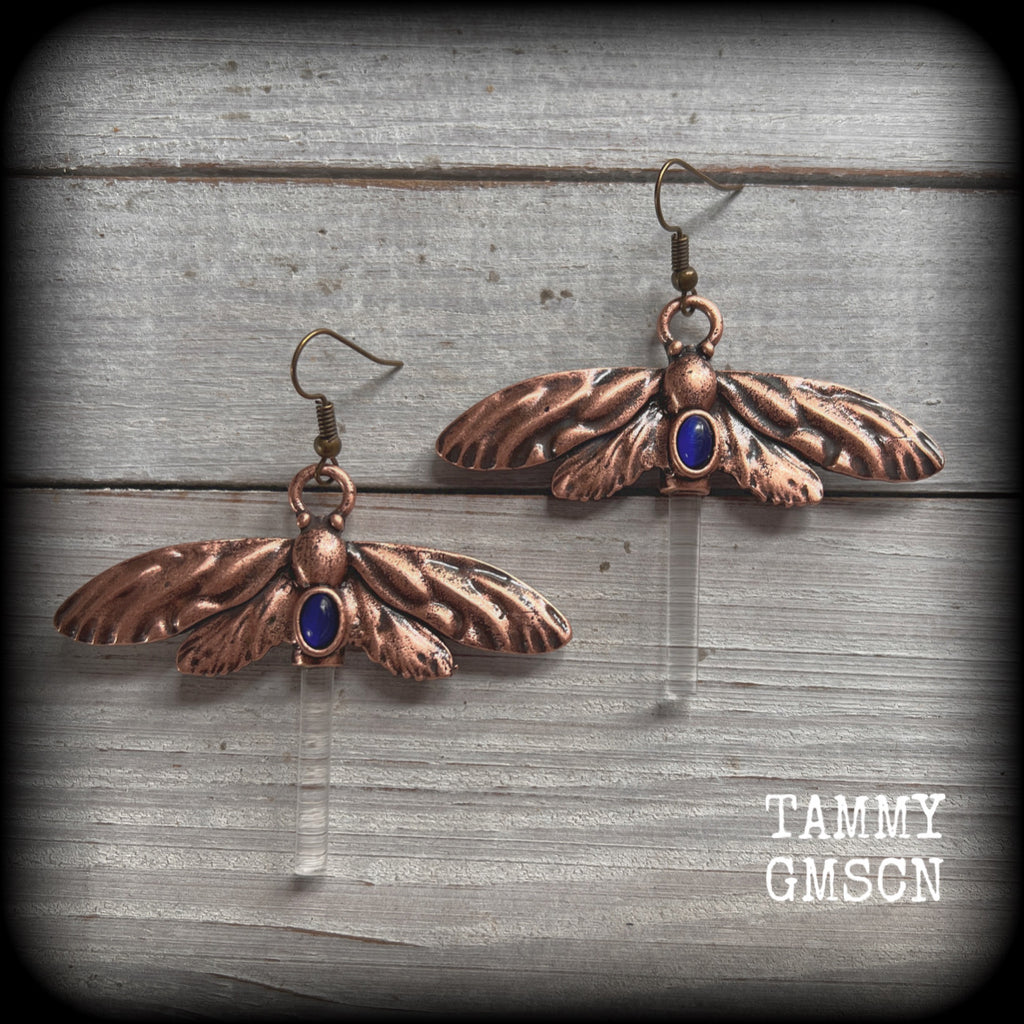 Large antique bronze dragonfly earrings with blue cabachon and cylindrical acrylic body, made on french hooks for pierced ears