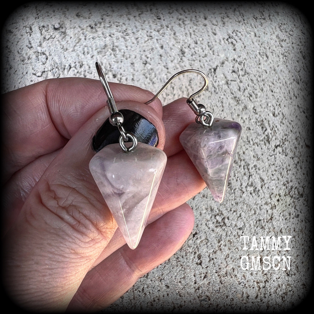 These earrings are made with beautiful milky white and dusty purple amethyst gemstones, nice and light weight at approx 5 grams each, and measure 5 cms from tip to tip.
This pair has been made with stainless steel french hooks, suitable for pierced ears.