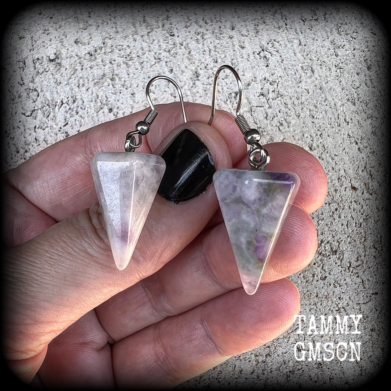 These earrings are made with beautiful milky white and dusty purple amethyst gemstones, nice and light weight at approx 5 grams each, and measure 5 cms from tip to tip.
This pair has been made with stainless steel french hooks, suitable for pierced ears.