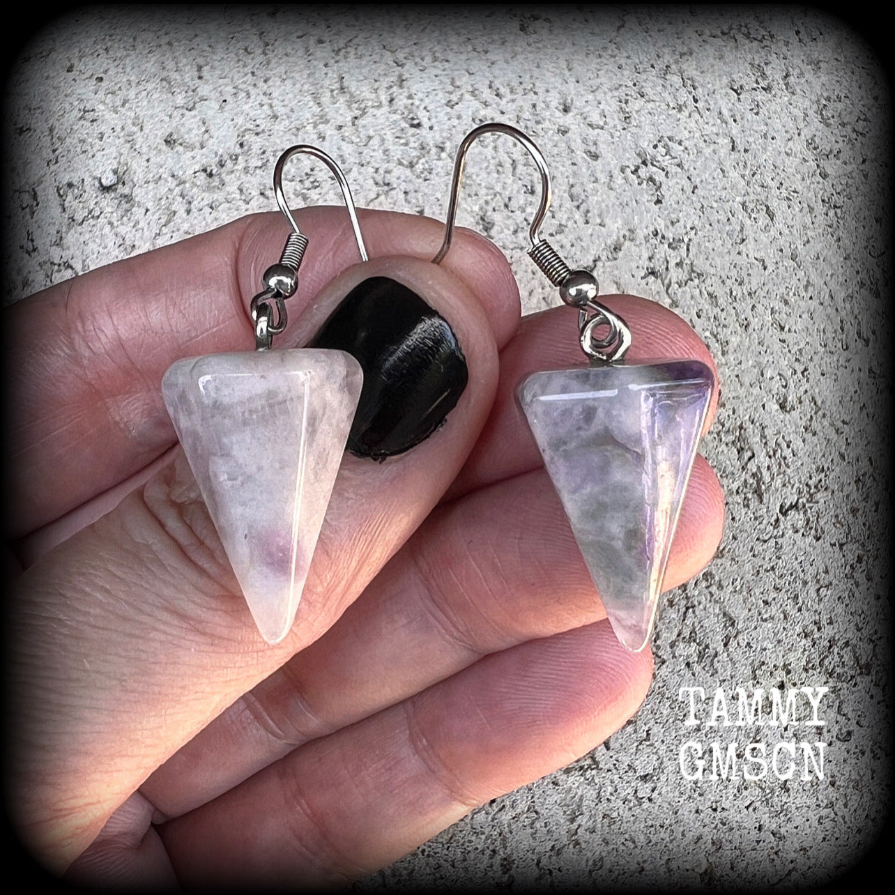 These earrings are made with beautiful milky white and dusty purple amethyst gemstones, nice and light weight at approx 5 grams each, and measure 5 cms from tip to tip.
This pair has been made with stainless steel french hooks, suitable for pierced ears.