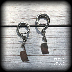 Featuring a pair of awesome antique silver meat cleavers, these earrings are super lightweight, weighing in at only 5 grams a piece, and are nice and dangly at just on 5.5cms.

🩸 Do you want a bit of b l o o d on your meat cleavers? Please just let us know!

This pair has been made on 6 gauge (4mm) surgical steel full curl hooks, to be worn in stretched lobes.