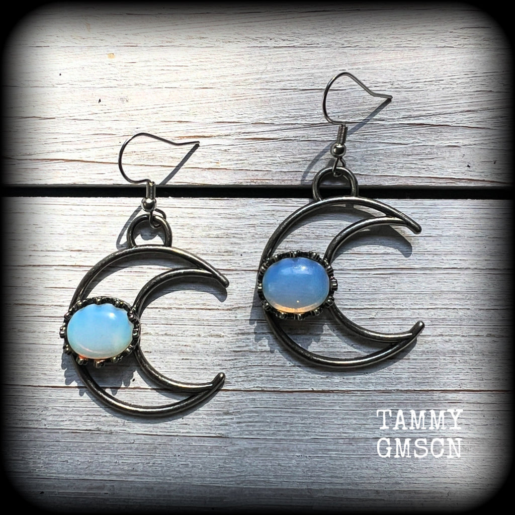 These gorgeous gunmetal grey crescent moon earrings feature beautiful milky white opalite gemstones, nice and dangly measuring approx 5.5cms from tip to tip, and are nice and light weight at around 5 grams each.

This pair has been made with stainless steel french hooks, suitable for pierced ears.