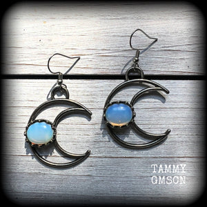 These gorgeous gunmetal grey crescent moon earrings feature beautiful milky white opalite gemstones, nice and dangly measuring approx 5.5cms from tip to tip, and are nice and light weight at around 5 grams each.

This pair has been made with stainless steel french hooks, suitable for pierced ears.