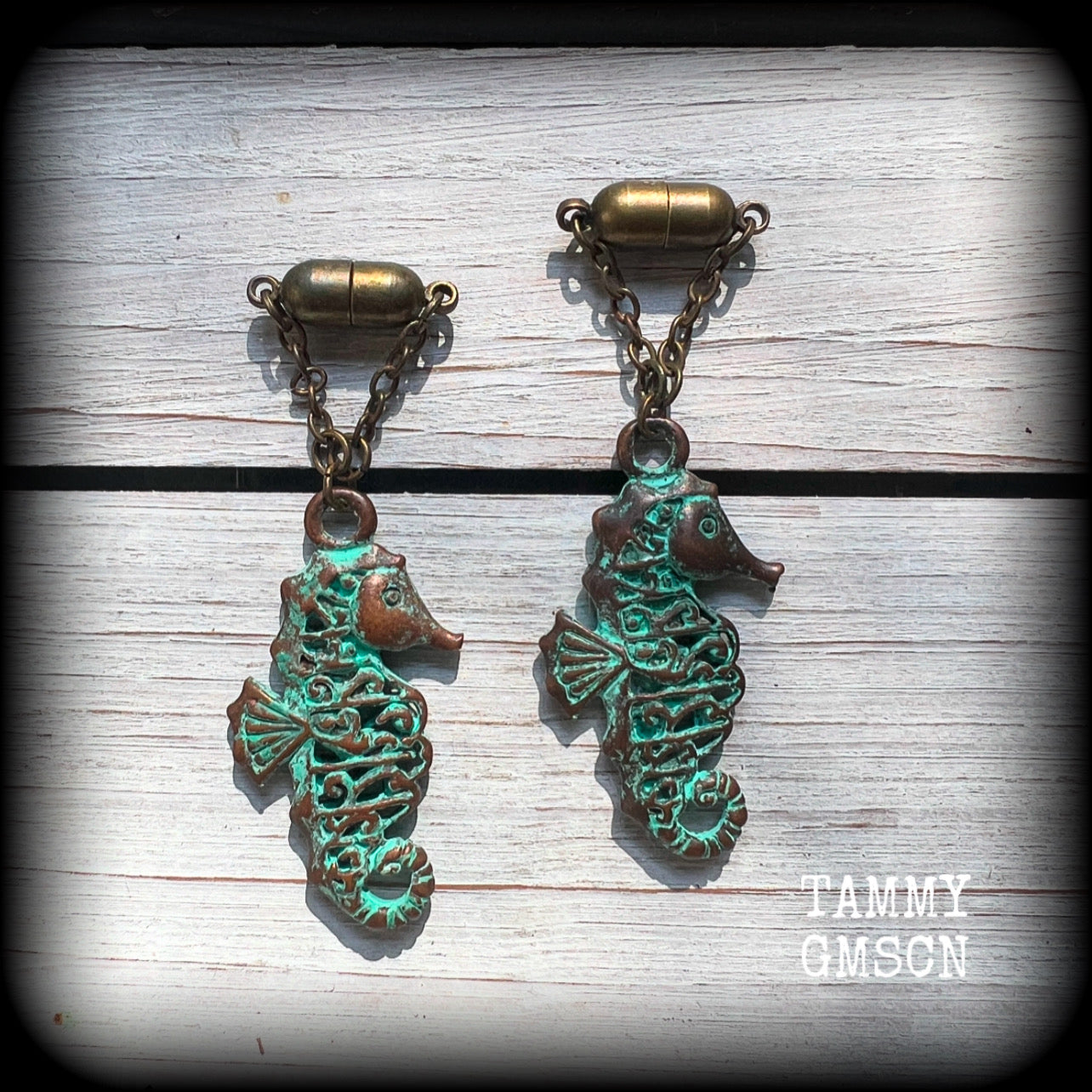 This pair of earrings features a gorgeous antique verdigris patina seahorse, measuring just over 6cms from tip to tip, and weighing 10 grams each.

This pair has been made with our chain/magnetic clasp 8mm option, suitable for stretched lobes when worn with silicone earlets or tunnels from 0 gauge (8mm).