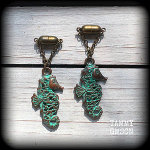 This pair of earrings features a gorgeous antique verdigris patina seahorse, measuring just over 6cms from tip to tip, and weighing 10 grams each.

This pair has been made with our chain/magnetic clasp 8mm option, suitable for stretched lobes when worn with silicone earlets or tunnels from 0 gauge (8mm).