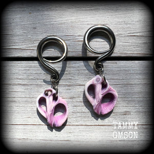 These gorgeous gauged earrings feature beautiful purple sea shell slices, weighing in approx 5 grams a piece, and measuring approx 5.5cms from tip to tip.

This pair has been made on 6 gauge (4mm) surgical steel full curl hooks, to be worn in stretched lobes.