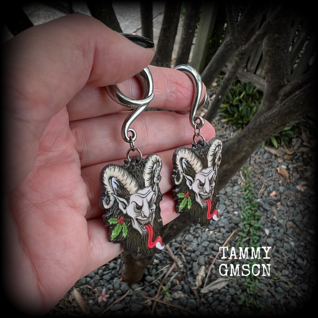 Featuring lightweight acrylic Krampus charms, these awesome gauged earrings weigh approx 10 grams each, and are lovely and dangly at just on 7cms from tip to tip.  This pair has been made on 2 gauge (6mm) surgical steel full curl hooks, to be worn in stretched lobes.