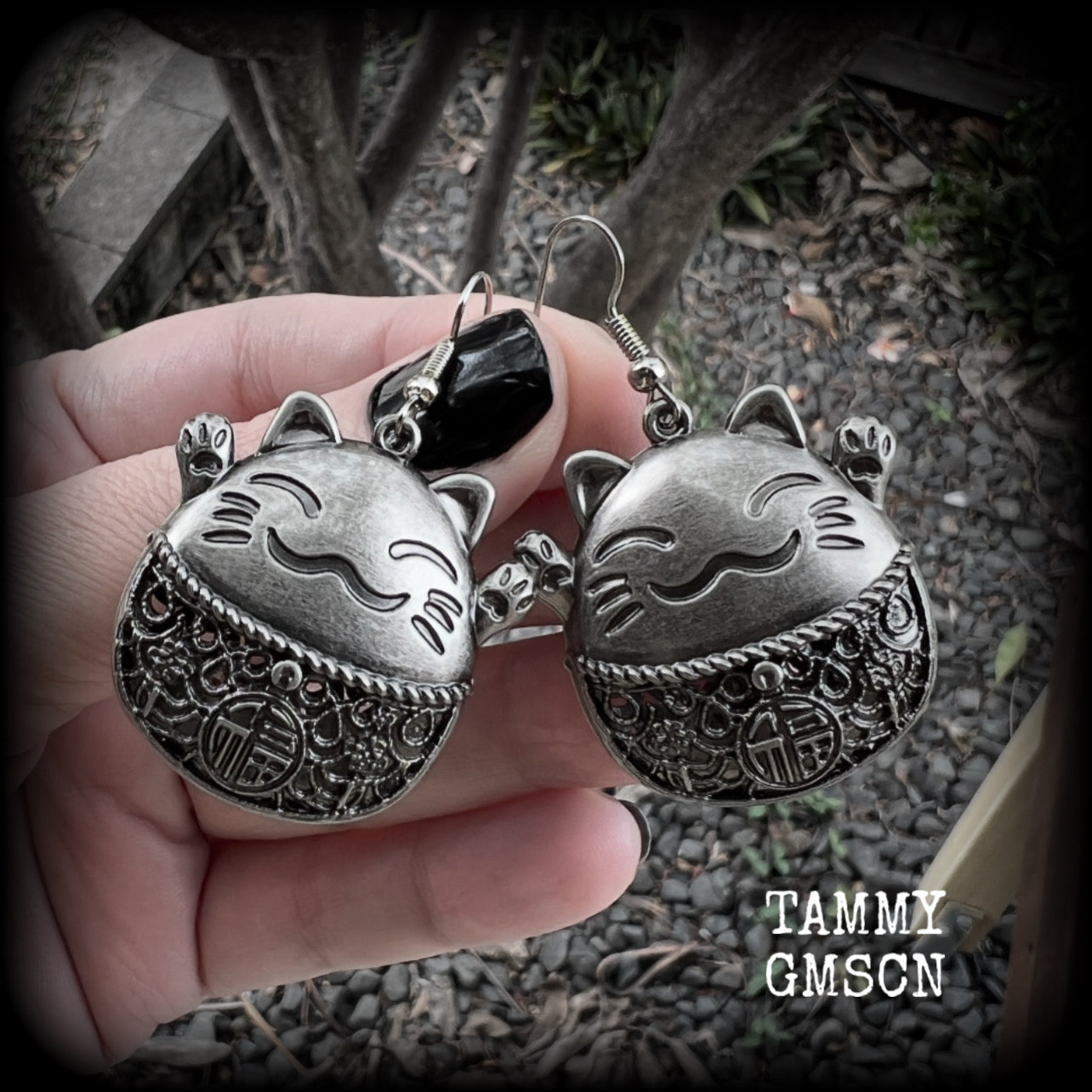 These gorgeous earrings features antique silver happy cat charms with the symbol for ‘good fortune’ on its tummy, measuring just on 5cms from tip to tip, and weighing approx 8 grams each.  This pair have been made on stainless steel french hooks, for pierced ears.