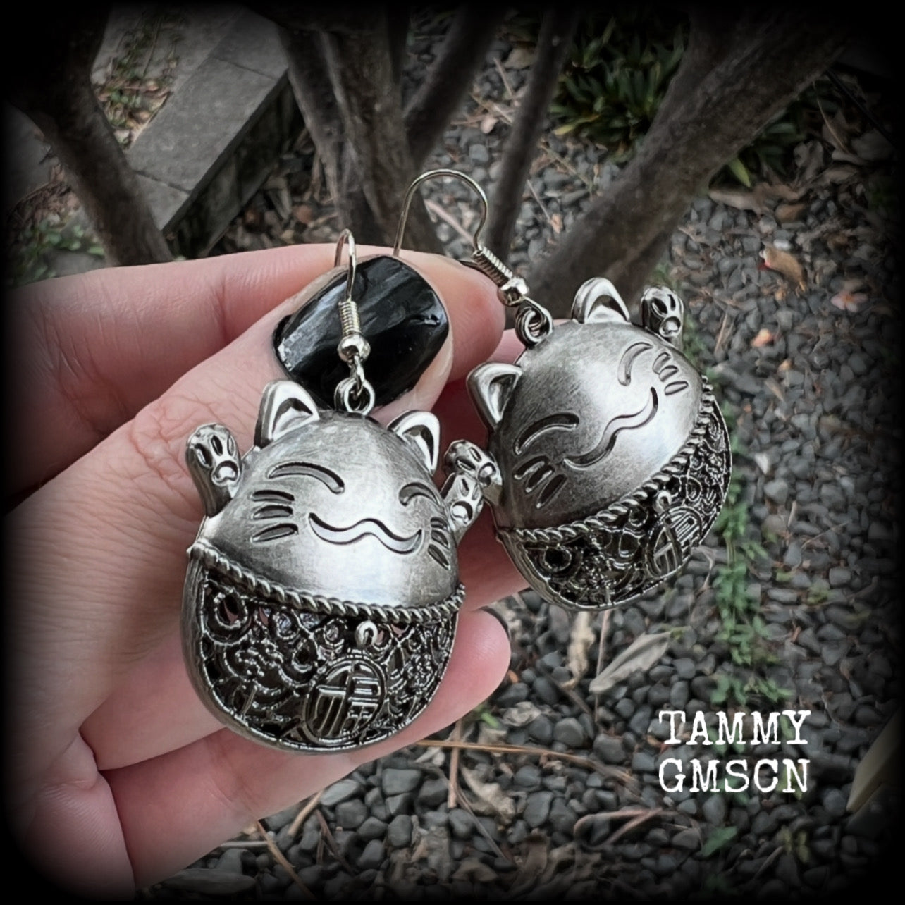 These gorgeous earrings features antique silver happy cat charms with the symbol for ‘good fortune’ on its tummy, measuring just on 5cms from tip to tip, and weighing approx 8 grams each.  This pair have been made on stainless steel french hooks, for pierced ears.