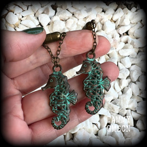 This pair of earrings features a gorgeous antique verdigris patina seahorse, measuring just over 6cms from tip to tip, and weighing 10 grams each.

This pair has been made with our chain/magnetic clasp 8mm option, suitable for stretched lobes when worn with silicone earlets or tunnels from 0 gauge (8mm).