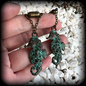 This pair of earrings features a gorgeous antique verdigris patina seahorse, measuring just over 6cms from tip to tip, and weighing 10 grams each.

This pair has been made with our chain/magnetic clasp 8mm option, suitable for stretched lobes when worn with silicone earlets or tunnels from 0 gauge (8mm).