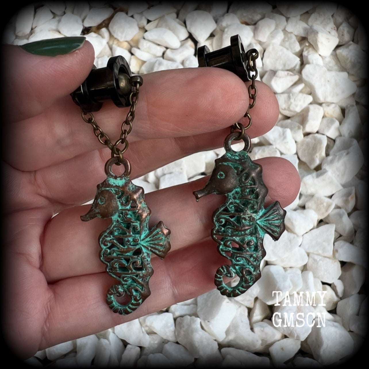 This pair of earrings features a gorgeous antique verdigris patina seahorse, measuring just over 6cms from tip to tip, and weighing 10 grams each.

This pair has been made with our chain/magnetic clasp 8mm option, suitable for stretched lobes when worn with silicone earlets or tunnels from 0 gauge (8mm).