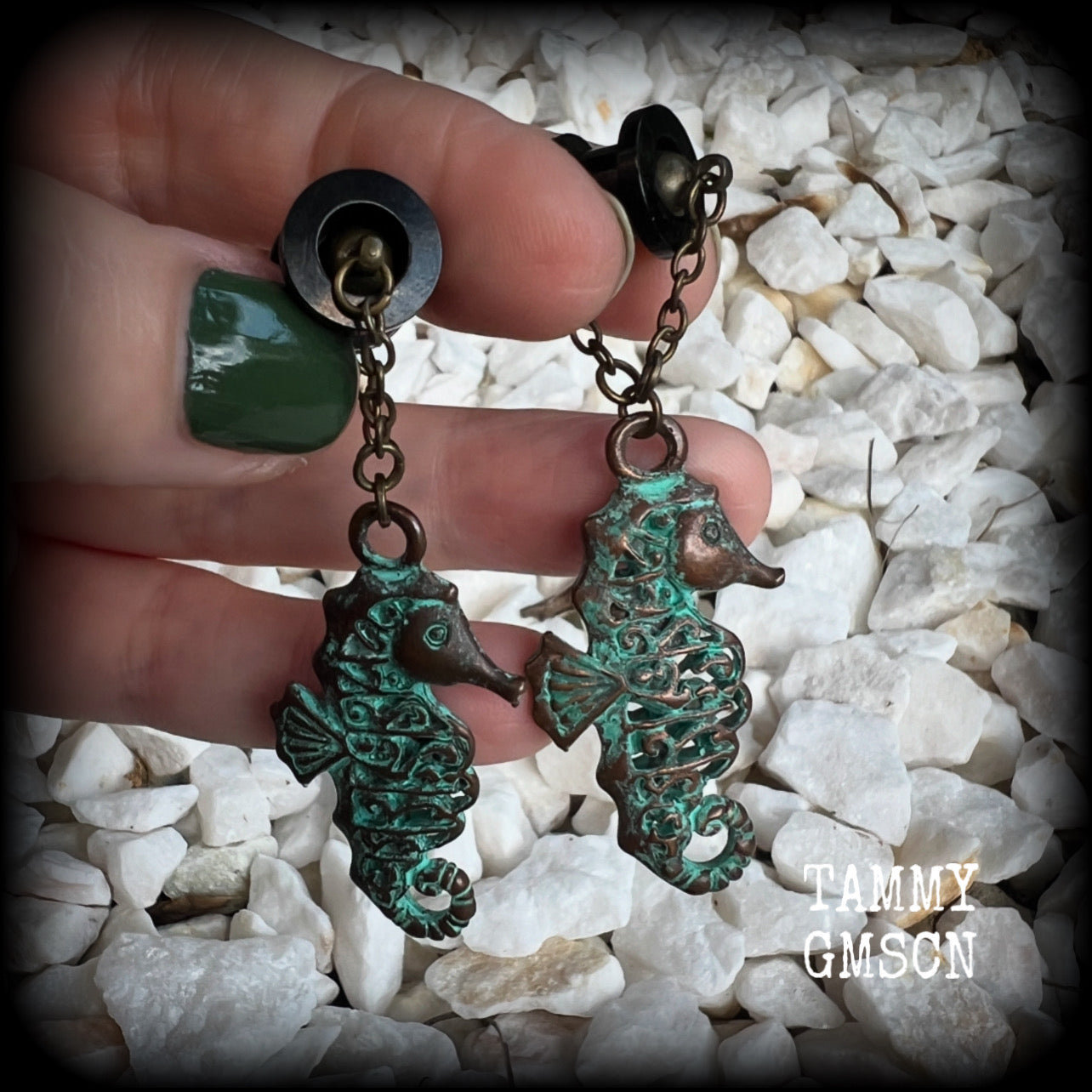 This pair of earrings features a gorgeous antique verdigris patina seahorse, measuring just over 6cms from tip to tip, and weighing 10 grams each.

This pair has been made with our chain/magnetic clasp 8mm option, suitable for stretched lobes when worn with silicone earlets or tunnels from 0 gauge (8mm).