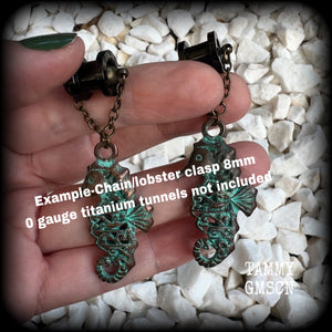 This pair of earrings features a gorgeous antique verdigris patina seahorse, measuring just over 6cms from tip to tip, and weighing 10 grams each.

This pair has been made with our chain/magnetic clasp 8mm option, suitable for stretched lobes when worn with silicone earlets or tunnels from 0 gauge (8mm).