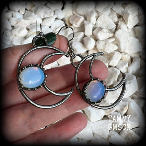 These gorgeous gunmetal grey crescent moon earrings feature beautiful milky white opalite gemstones, nice and dangly measuring approx 5.5cms from tip to tip, and are nice and light weight at around 5 grams each.

This pair has been made with stainless steel french hooks, suitable for pierced ears.