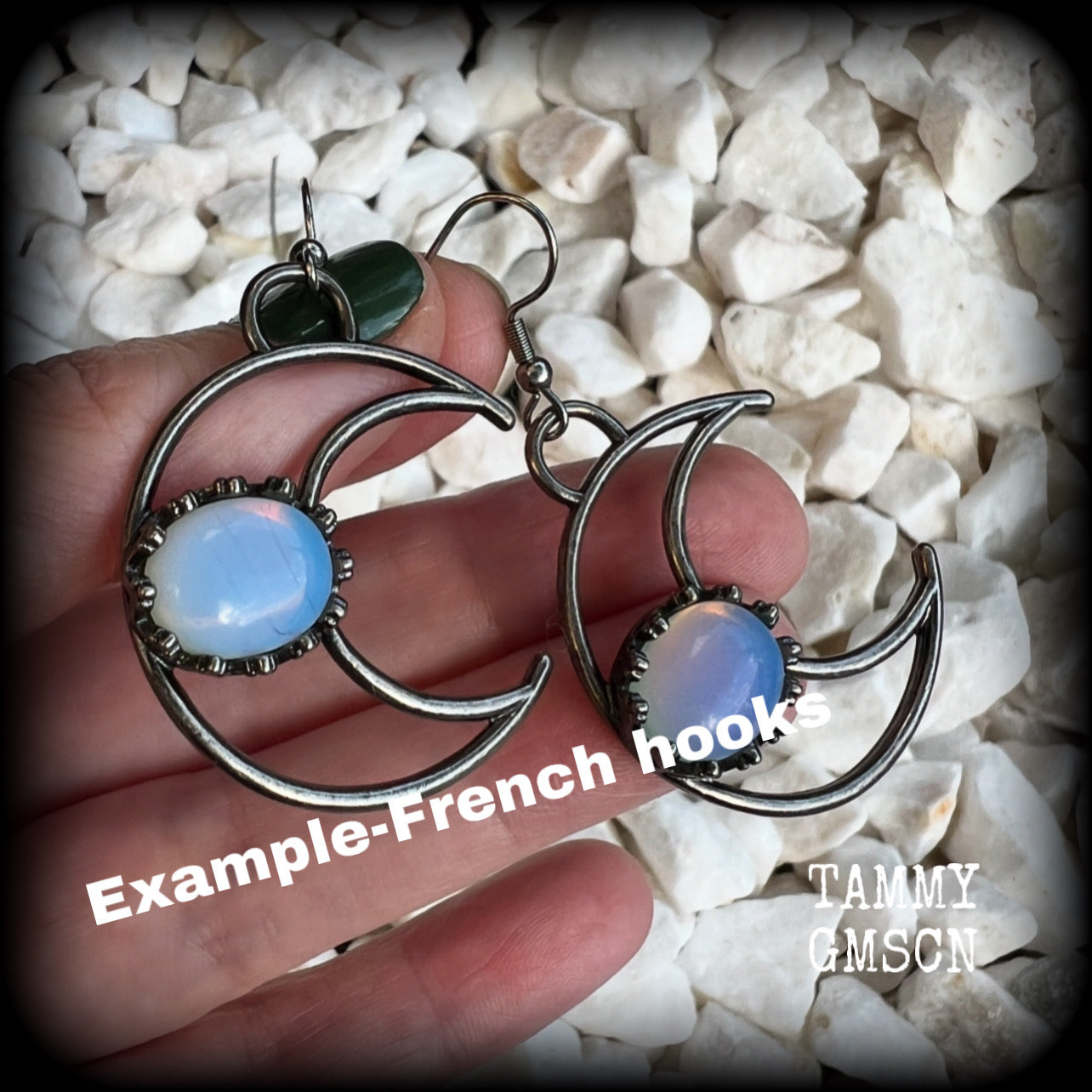 These gorgeous gunmetal grey crescent moon earrings feature beautiful milky white opalite gemstones, nice and dangly measuring approx 5.5cms from tip to tip, and are nice and light weight at around 5 grams each.

This pair has been made with stainless steel french hooks, suitable for pierced ears.