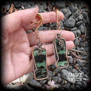 These beautiful steampunk inspired gauged earrings feature gorgeous big rustic wire wrapped ruby zoisite gemstones, measuring 9.5cms from tip to tip, and weighing approx 20 grams each.

This pair has been made on 2 gauge (6mm) titanium coated surgical steel full curl hooks, suitable for stretched lobes.