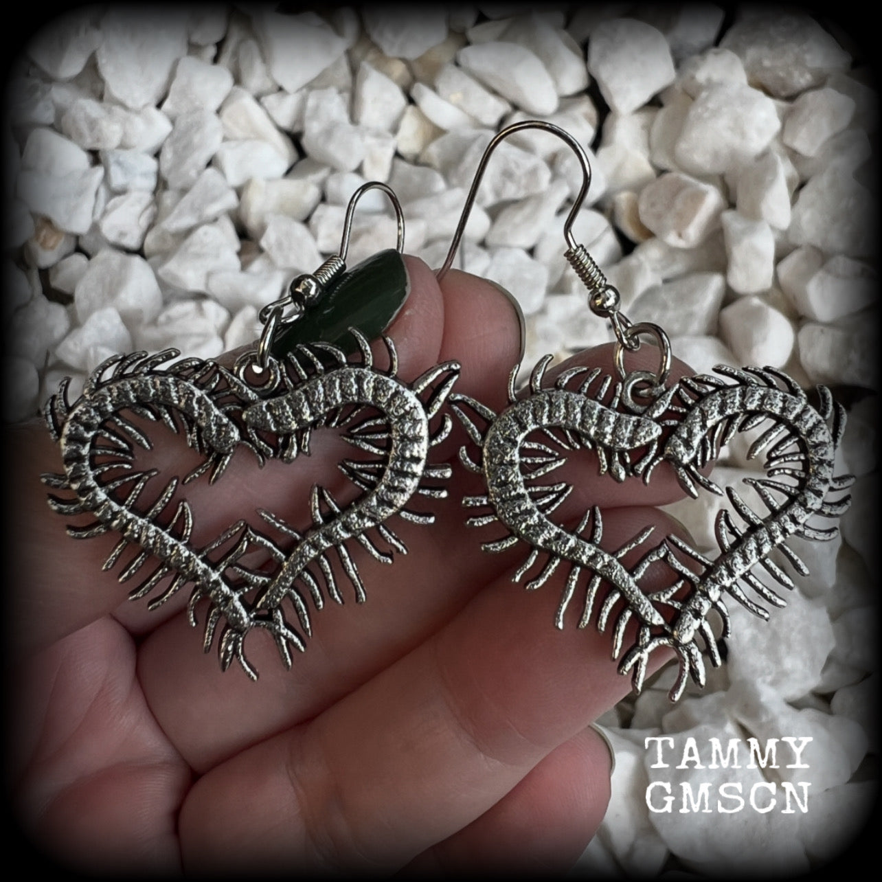 These awesome earrings feature lightweight love heart centipedes, weighing only 5 grams each and measuring approx 5cms from tip to tip.

This pair have been made on stainless steel french hooks, to be worn through pierced ears.