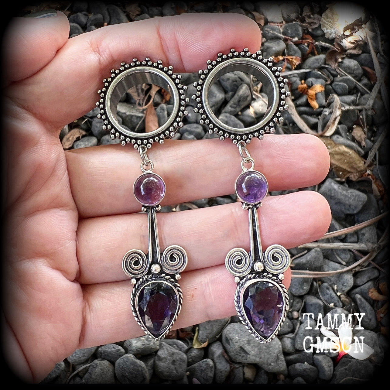 These gorgeous tunnel earrings have been made with beautiful polished and facet amethyst gemstones and antique silver boho settings.
These earrings are beautifully light weight, weighing approx 13 grams each and measure just under 8cms from tip to tip.

This pair have been made with 3/4" gauge (19mm) ornate surgical steel screw fit tunnels.