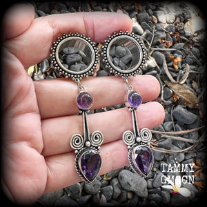 These gorgeous tunnel earrings have been made with beautiful polished and facet amethyst gemstones and antique silver boho settings.
These earrings are beautifully light weight, weighing approx 13 grams each and measure just under 8cms from tip to tip.

This pair have been made with 3/4" gauge (19mm) ornate surgical steel screw fit tunnels.