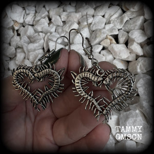 These awesome earrings feature lightweight love heart centipedes, weighing only 5 grams each and measuring approx 5cms from tip to tip.

This pair have been made on stainless steel french hooks, to be worn through pierced ears.