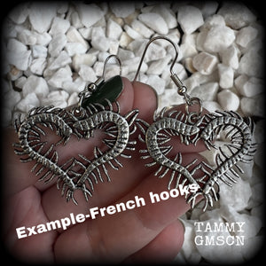 These awesome earrings feature lightweight love heart centipedes, weighing only 5 grams each and measuring approx 5cms from tip to tip.

This pair have been made on stainless steel french hooks, to be worn through pierced ears.