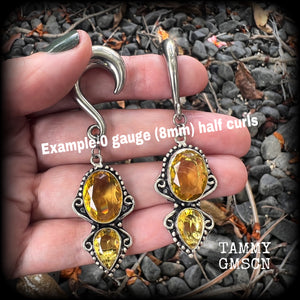 Made with gorgeous facet yellow citrine gemstones, lovely and dangly at just under 8 from tip to tip, and weighing approx 15 grams each.
These earrings have been made on 0 gauge (8mm) surgical steel half curl hooks, to be worn in stretched lobes.