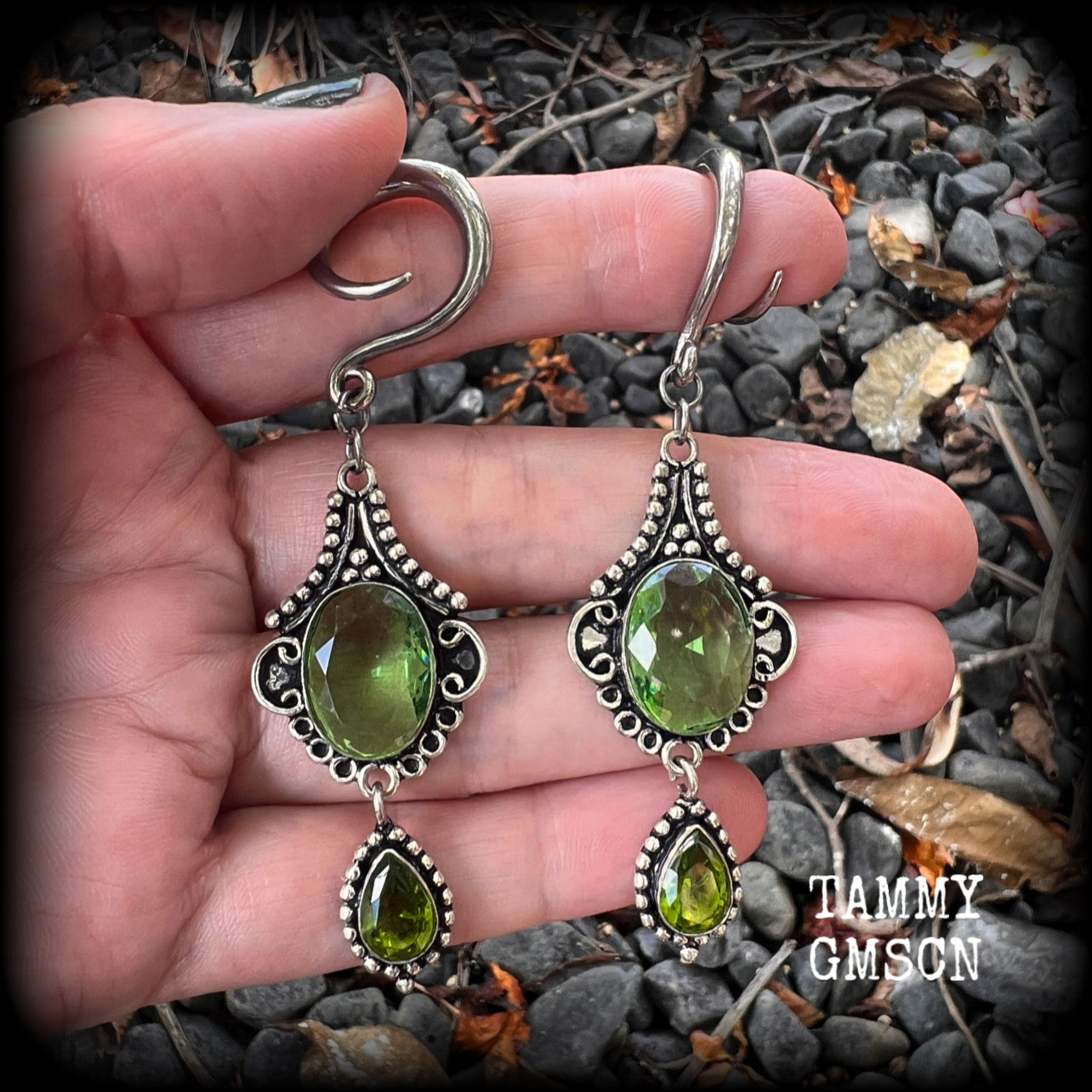 This pairof Peridot and antique silver gauged earrings weigh approx 9 grams a piece, nice and lightweight, and measuring approx 8cms from tip to tip.
These have been made on 6 gauge (4mm) surgical steel full curl hooks, to be worn in stretched lobes.