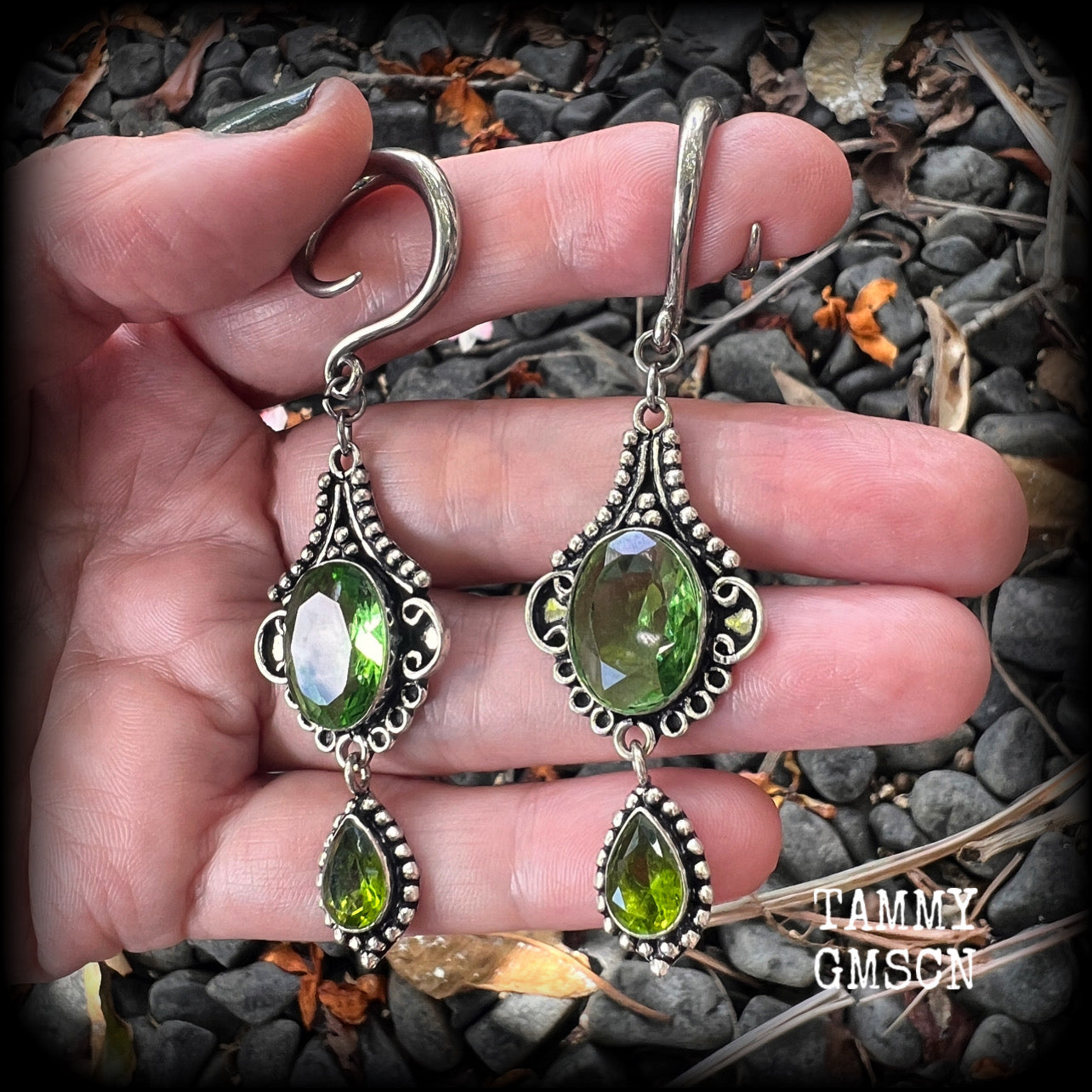 This pairof Peridot and antique silver gauged earrings weigh approx 9 grams a piece, nice and lightweight, and measuring approx 8cms from tip to tip.
These have been made on 6 gauge (4mm) surgical steel full curl hooks, to be worn in stretched lobes.