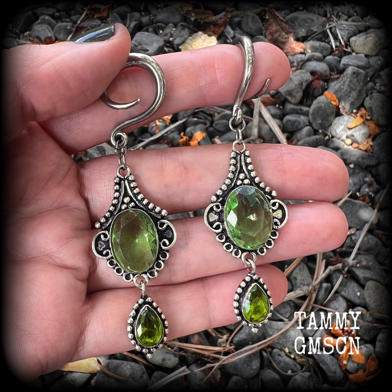 This pairof Peridot and antique silver gauged earrings weigh approx 9 grams a piece, nice and lightweight, and measuring approx 8cms from tip to tip.
These have been made on 6 gauge (4mm) surgical steel full curl hooks, to be worn in stretched lobes.