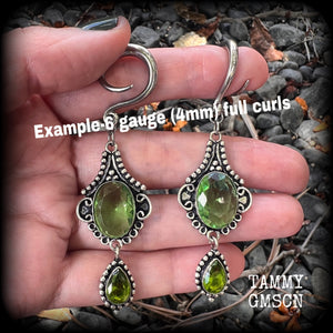 This pairof Peridot and antique silver gauged earrings weigh approx 9 grams a piece, nice and lightweight, and measuring approx 8cms from tip to tip.
These have been made on 6 gauge (4mm) surgical steel full curl hooks, to be worn in stretched lobes.